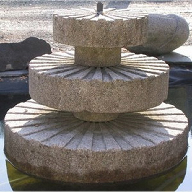 Wasserspiel Mühlsteine Fengshui Garten